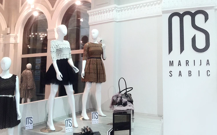 Marija Šabić identity applied to a storefront.